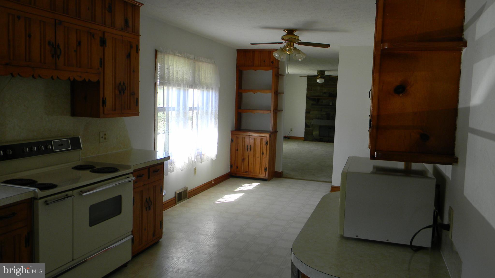 6688 Brocks Gap Road Broadway, VA 22815 - Photo 28 of 81 a kitchen with stainless steel appliances granite countertop a stove and a refrigerator