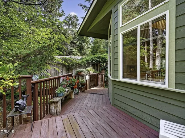 a view of balcony with deck and outdoor seating