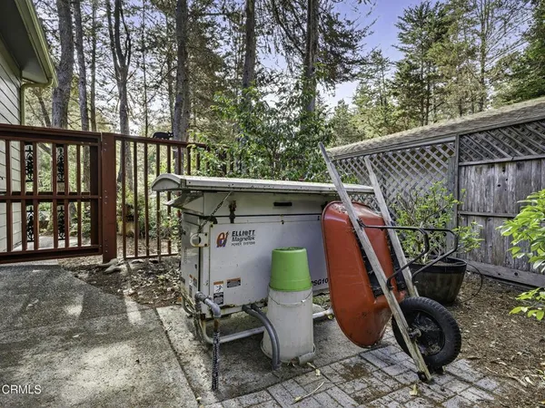 a view of a patio with table and chairs and potted plants