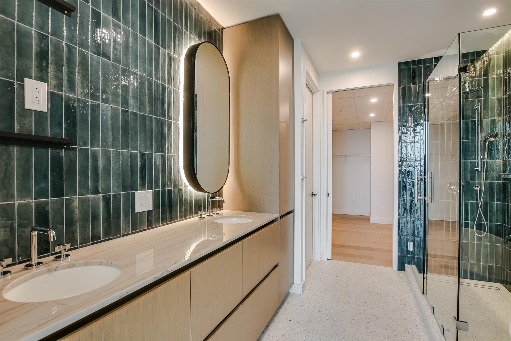 610 Davis Street, Unit 4704 Austin, TX 78701 - Photo 14 of 40 a bathroom with a granite countertop sink a mirror and shower