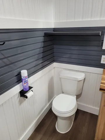 a bathroom with a toilet and a sink