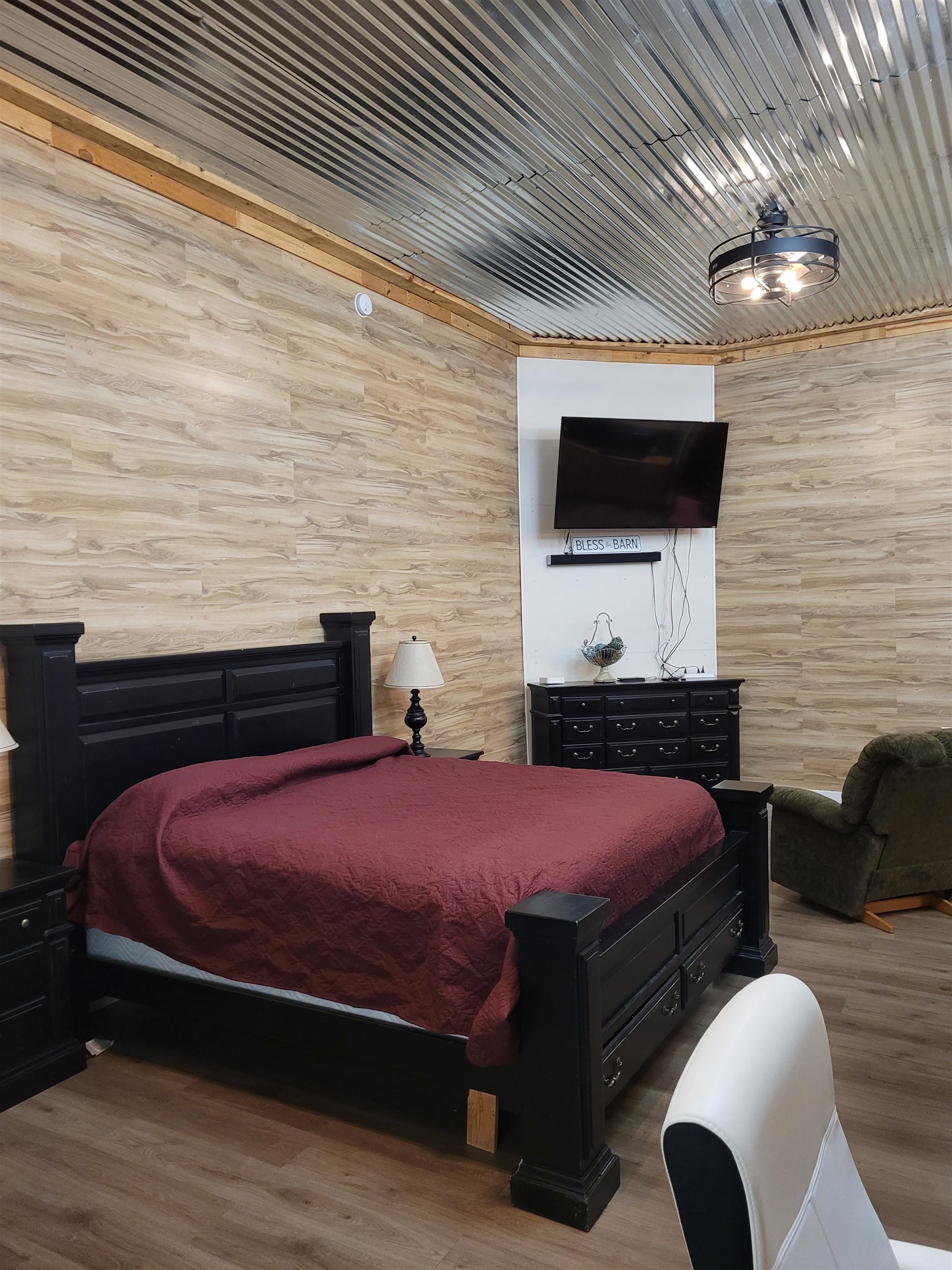 4186 Marvin Chapel Road Brownsville, TN 38012 - Photo 3 of 37 a bedroom with a bed and a flat screen tv