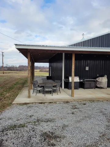 a view of a chairs and table in the patio