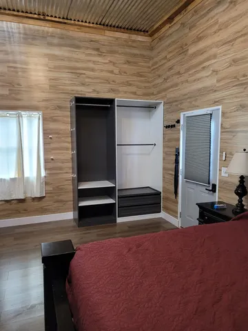 a bedroom with a bed and a dresser