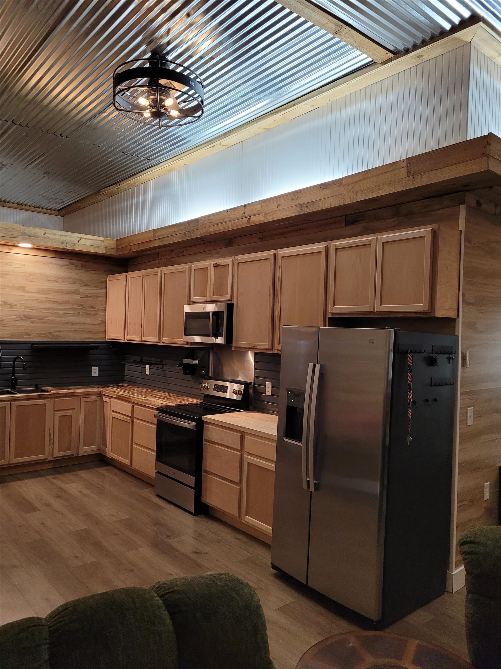 4186 Marvin Chapel Road Brownsville, TN 38012 - Photo 10 of 37 a kitchen with stainless steel appliances kitchen island granite countertop a refrigerator a stove and a sink