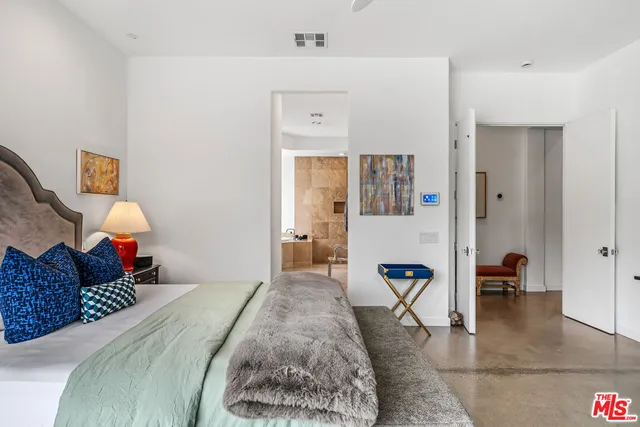 an aerial view of a house with a garden and lake view