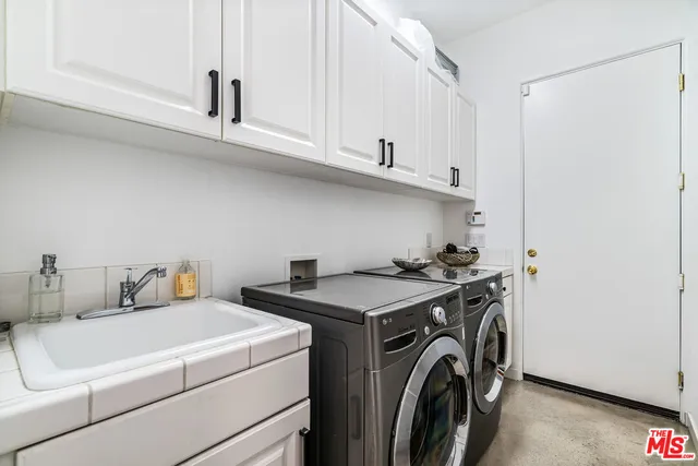 an aerial view of a house with swimming pool patio and outdoor seating