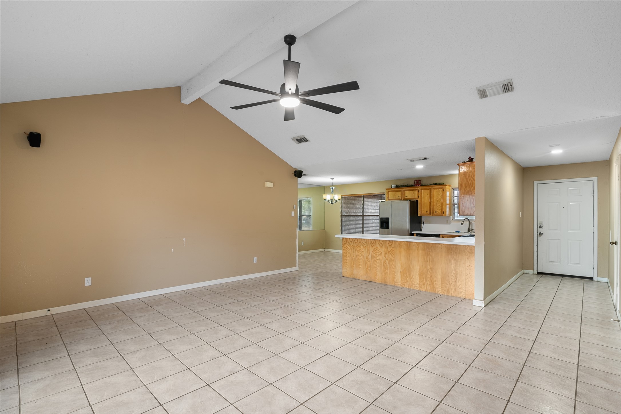18914 Hamish Road Tomball, TX 77377 - Photo 13 of 39 a view of a kitchen with a sink and a refrigerator