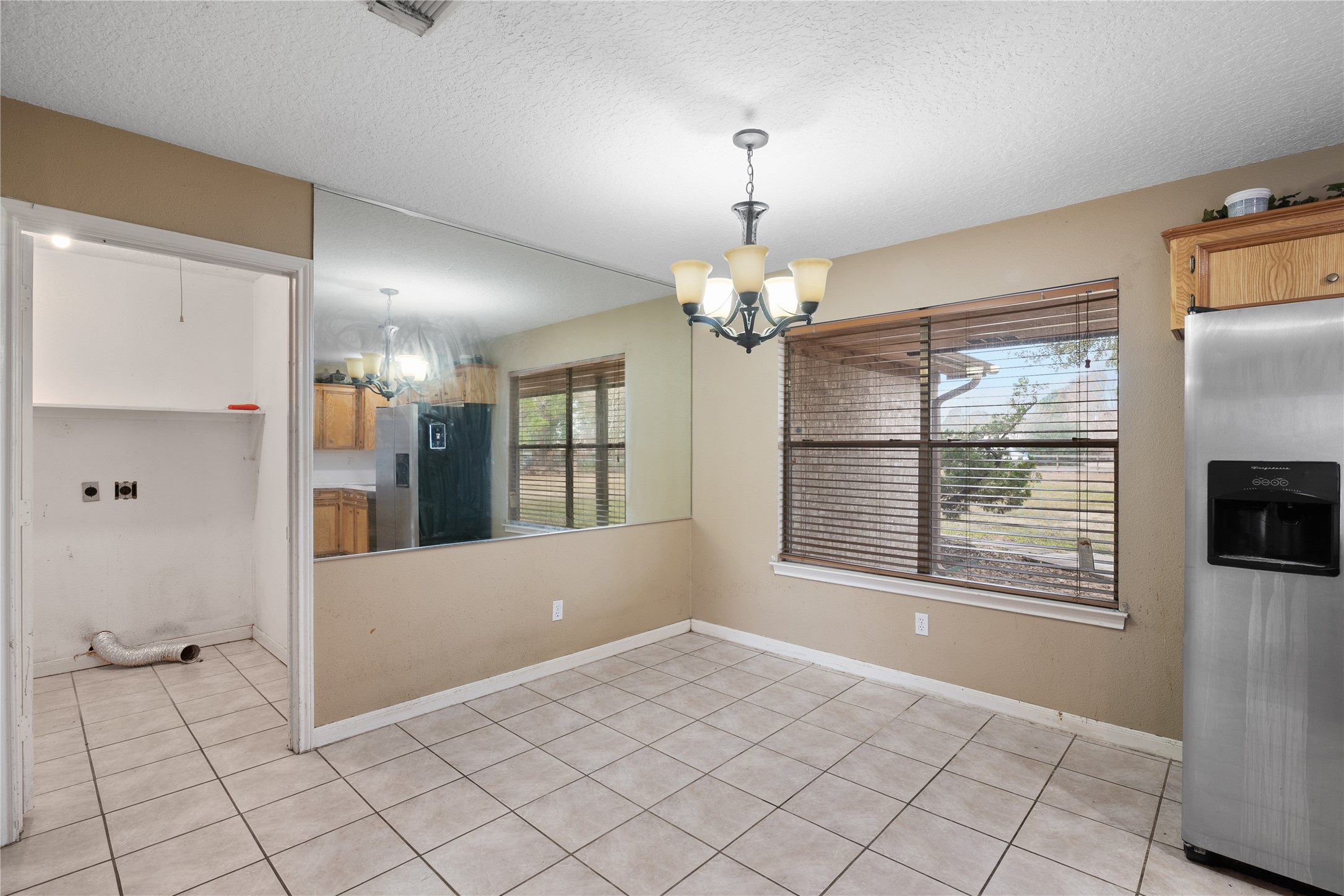 18914 Hamish Road Tomball, TX 77377 - Photo 17 of 39 a view of an empty room with a fireplace and a window