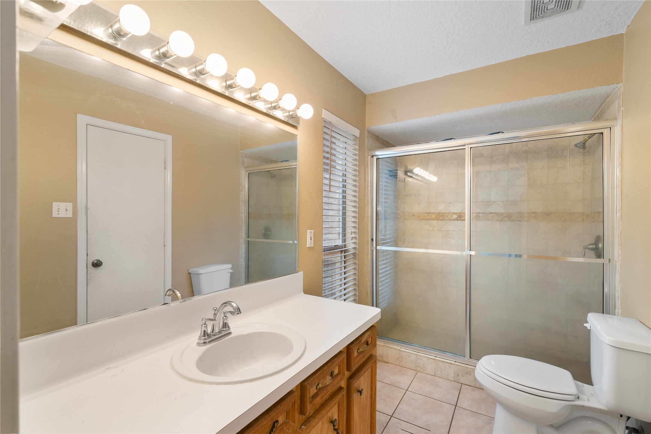 18914 Hamish Road Tomball, TX 77377 - Photo 22 of 39 a bathroom with a sink a toilet and shower