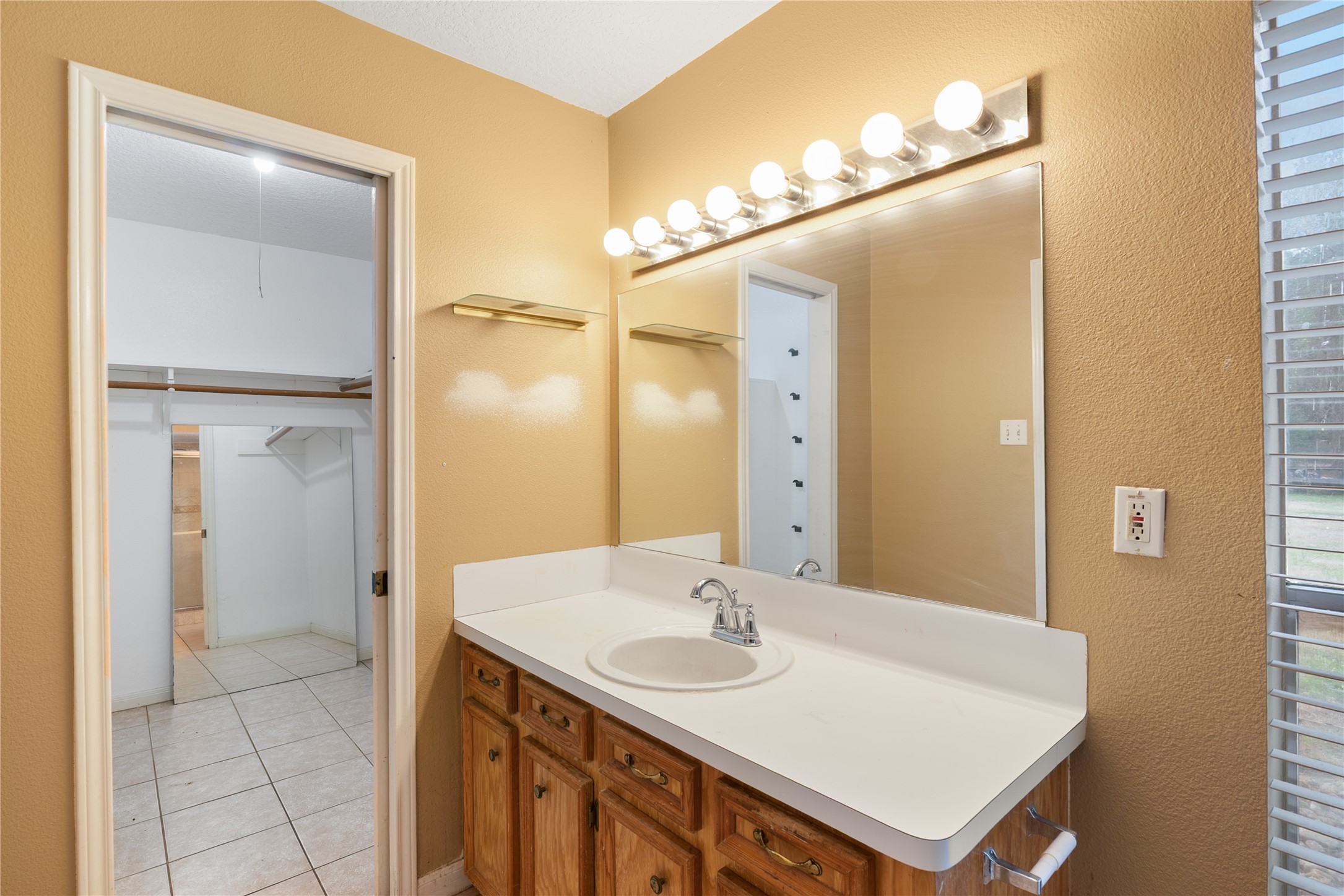 18914 Hamish Road Tomball, TX 77377 - Photo 23 of 39 a bathroom with a sink a mirror and a shower
