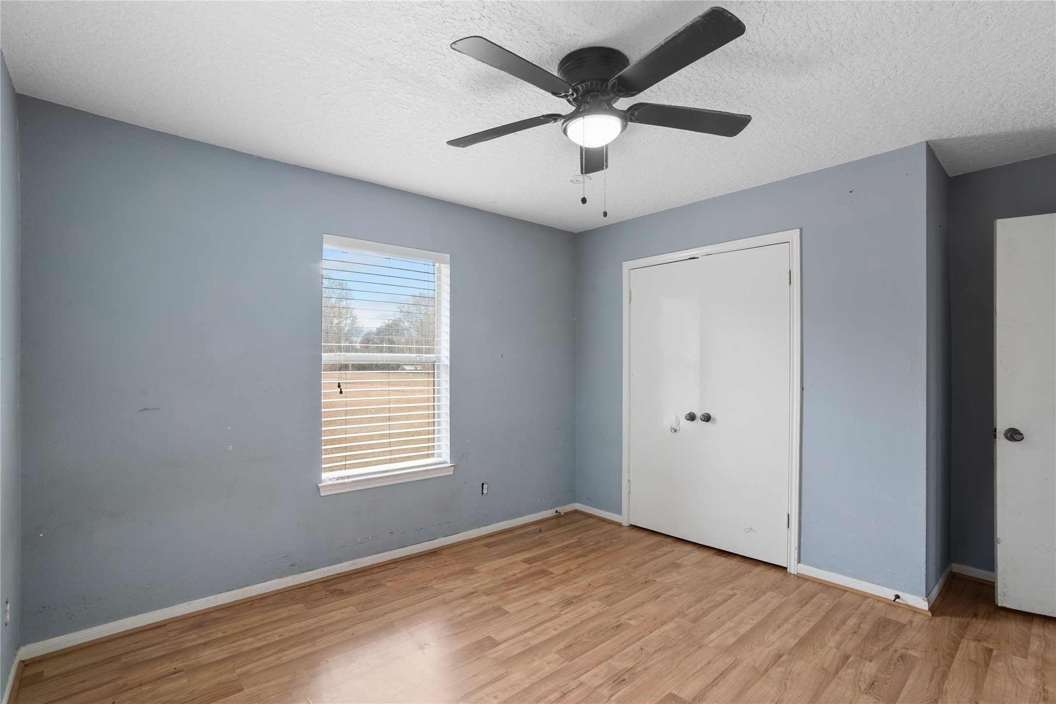 18914 Hamish Road Tomball, TX 77377 - Photo 30 of 39 an empty room with wooden floor and windows