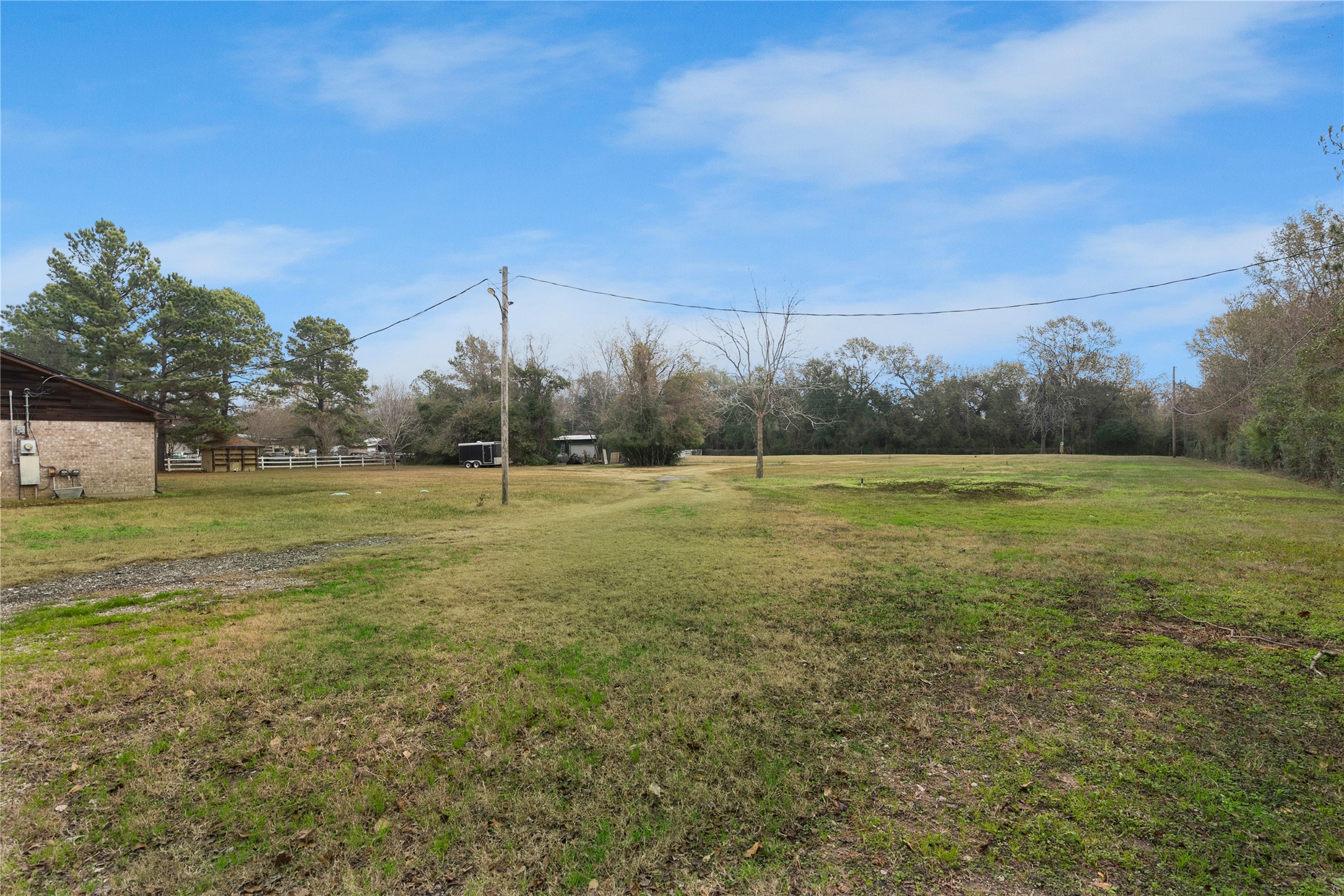 18914 Hamish Road Tomball, TX 77377 - Photo 38 of 39 a view of a field with an trees in the background