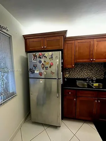 a view of a refrigerator and storage