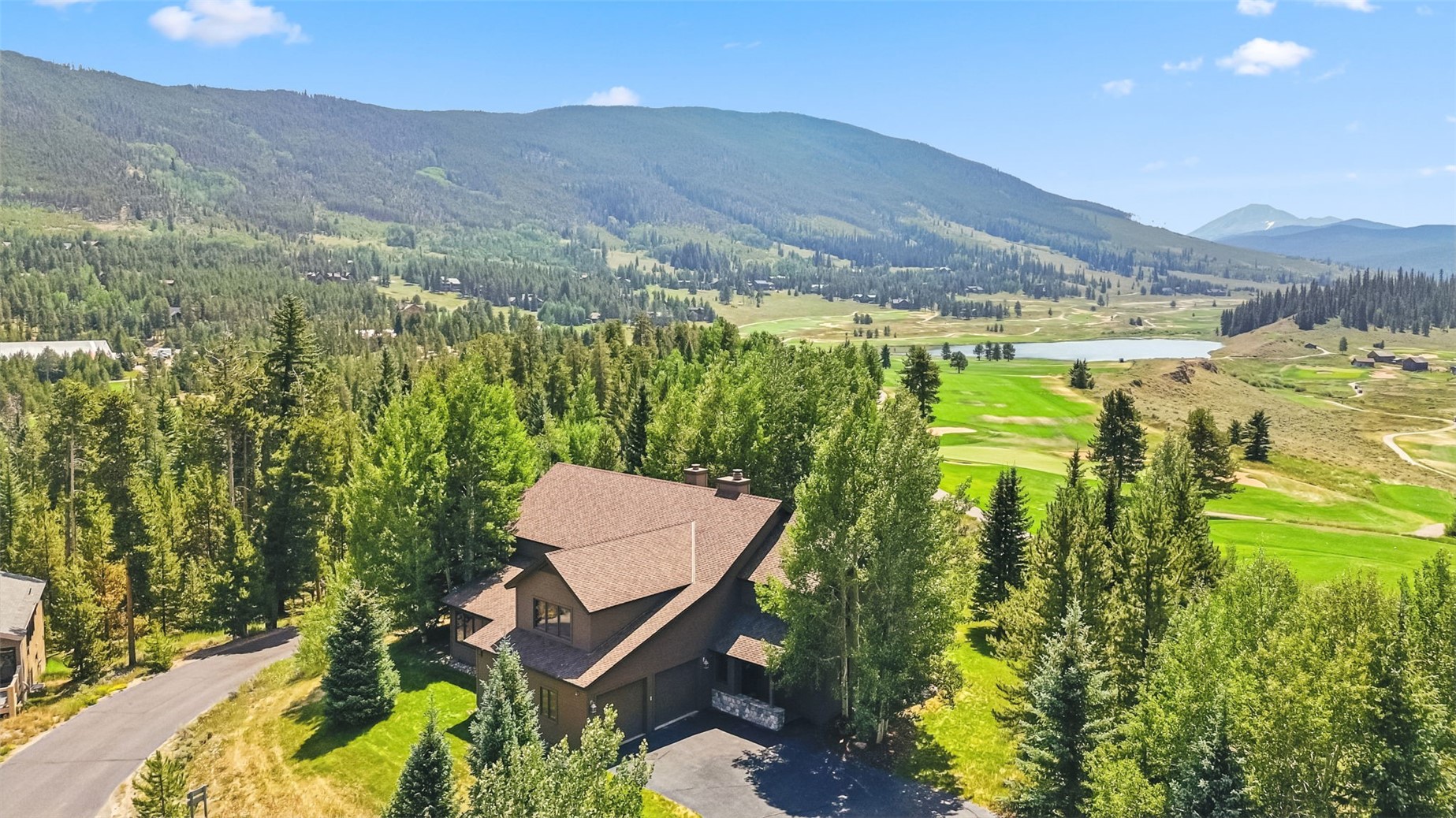 Aerial view of 272 Penstemon and the surrounding golf course and mountain views.