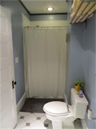 11 Hurd Road, Unit 2 Brookline, MA 02445 - Photo 15 of 18 a white toilet sitting next to a bath tub