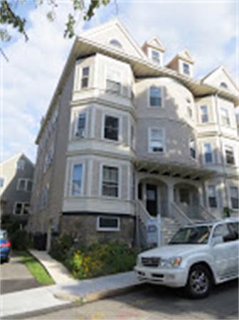 11 Hurd Road, Unit 2 Brookline, MA 02445 - Photo 2 of 18 a car parked in front of a building