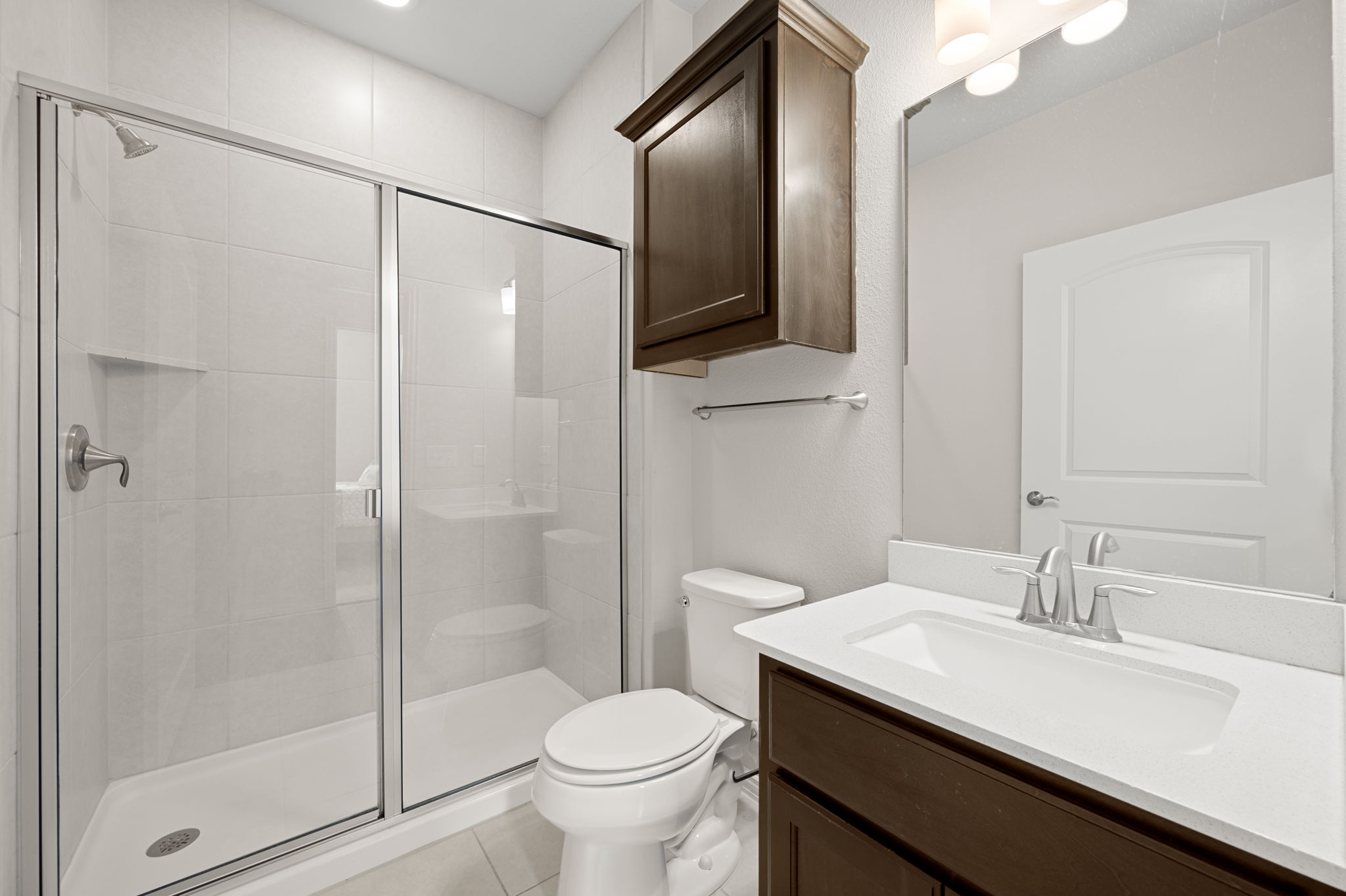 8800 Slater Drive Austin, TX 78747 - Photo 23 of 40 a bathroom with a sink toilet and shower