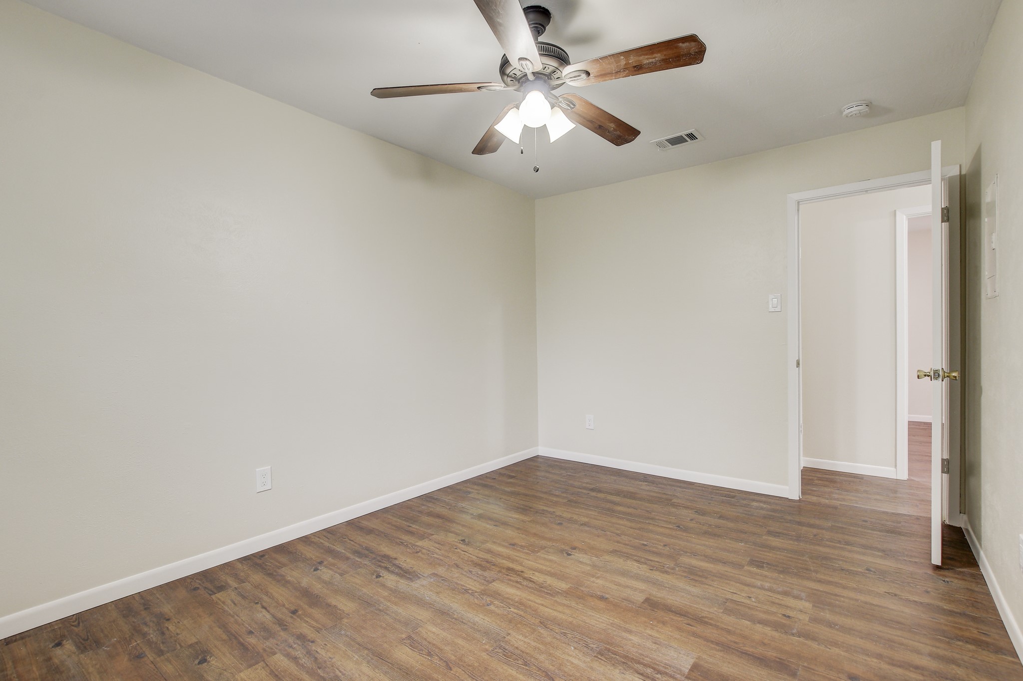 6902 Rifle Bend Austin, TX 78736 - Photo 23 of 33 wooden floor in an empty room
