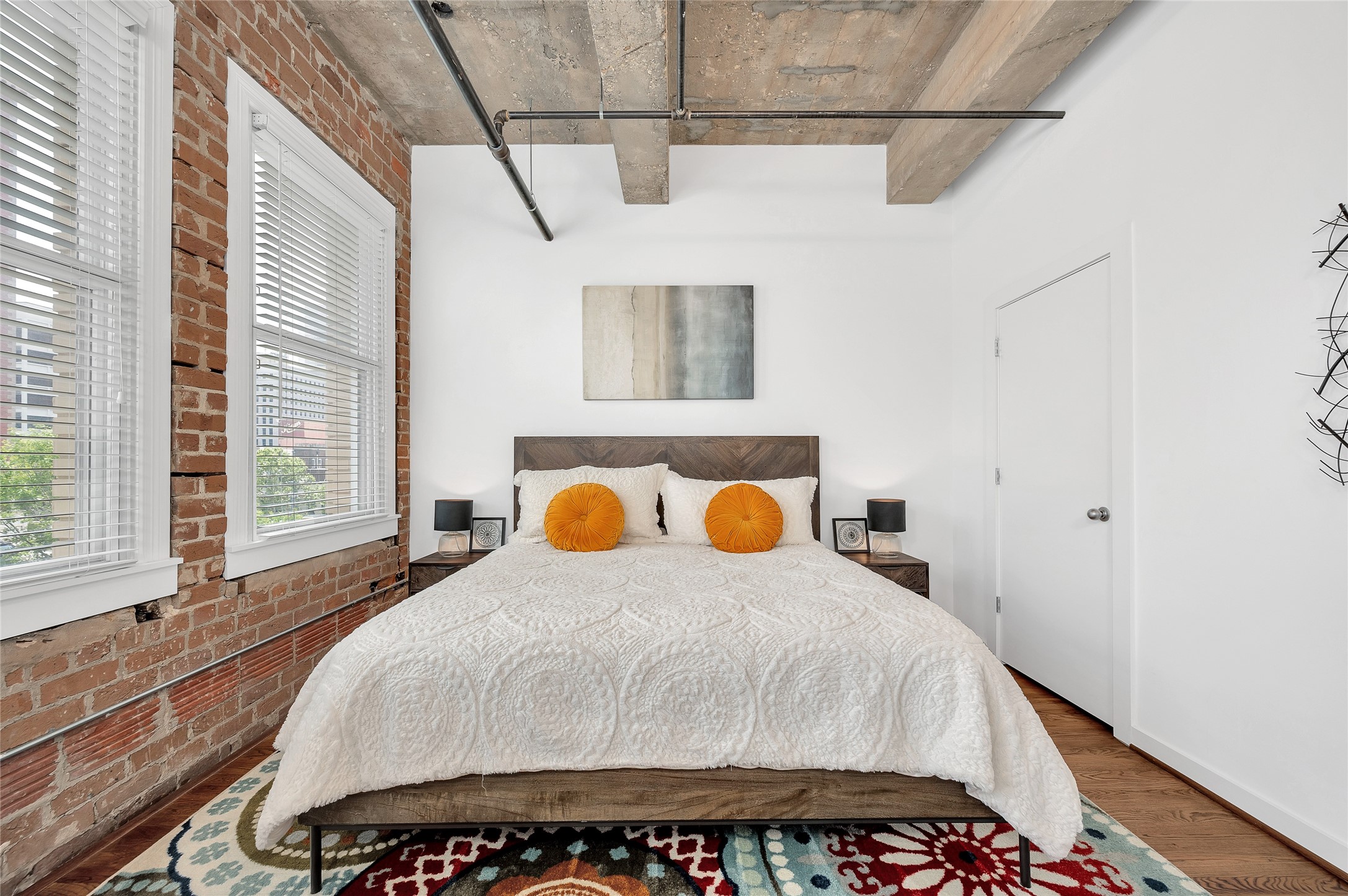 204 Travis Street, Unit 4A Houston, TX 77002 - Photo 12 of 34 a bedroom with a bed and window