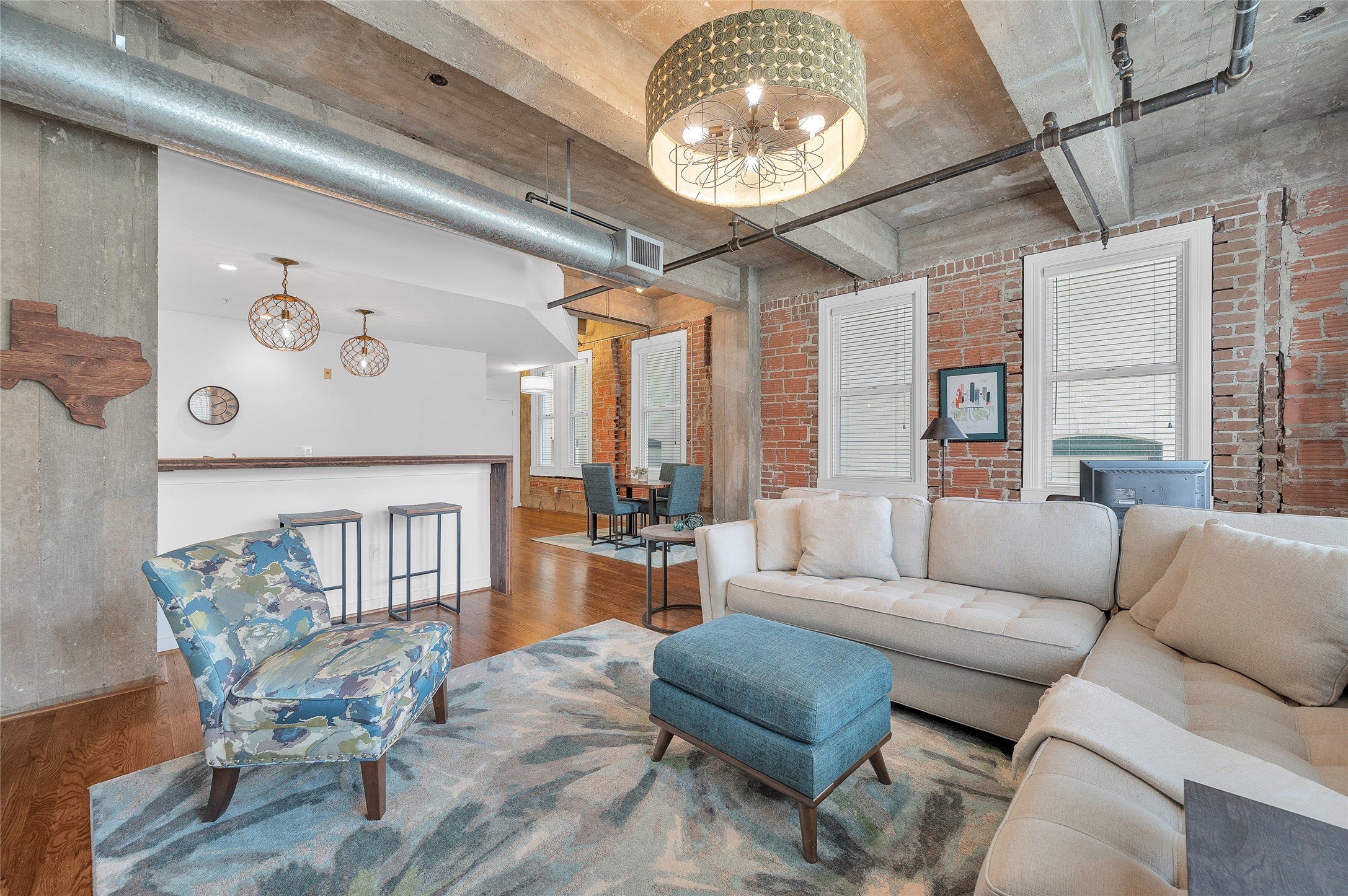 204 Travis Street, Unit 4A Houston, TX 77002 - Photo 4 of 34 a living room with furniture and a large window