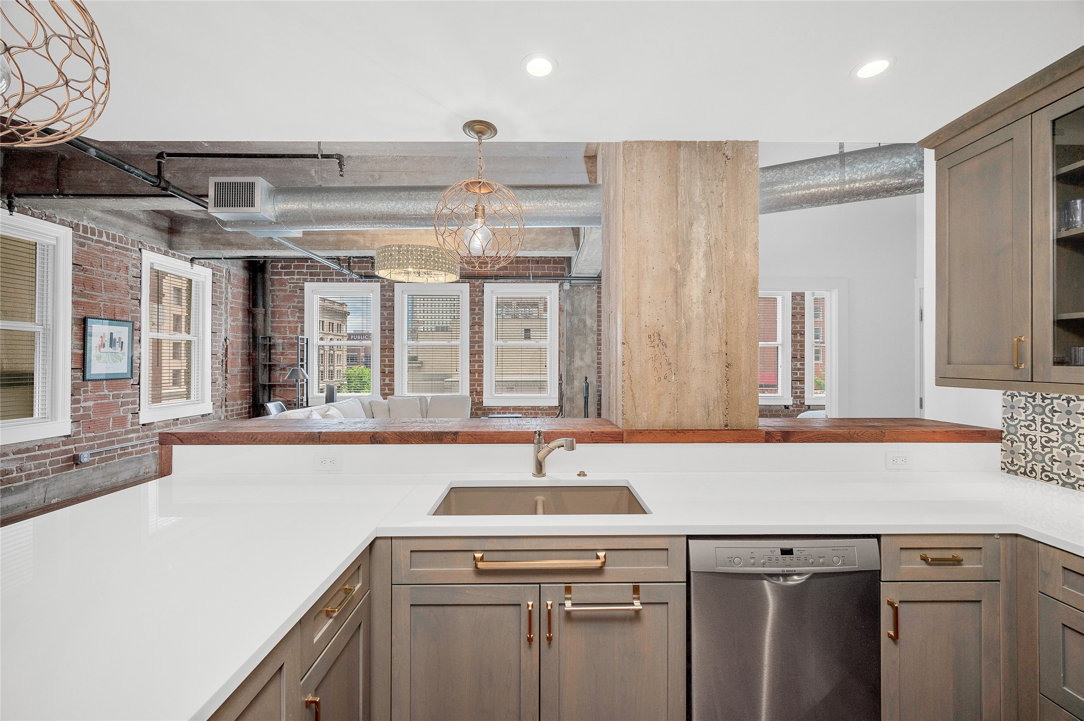 204 Travis Street, Unit 4A Houston, TX 77002 - Photo 8 of 34 a kitchen with a sink and cabinets