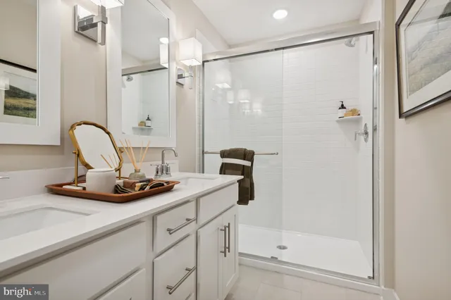 a view of a bathroom with a shower and a sink