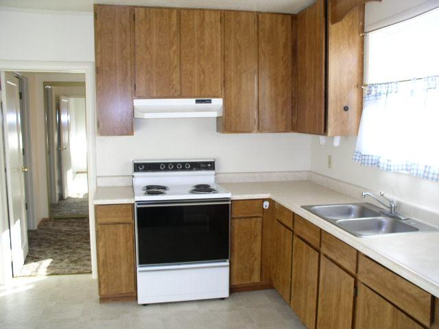 2791 Henderson Road Redding, CA 96002 - Photo 3 of 6 a kitchen with a sink stove and cabinets