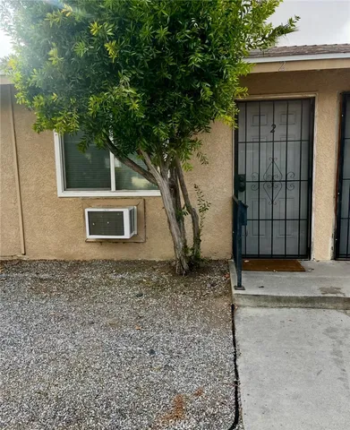 a house with trees in front of it