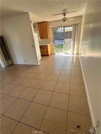 a view of a livingroom with kitchen and furniture