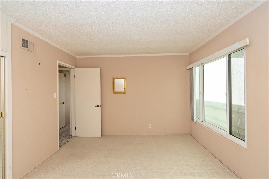 21 7th Place, Unit 409 Long Beach, CA 90802 - Photo 11 of 16 a view of an empty room with a window