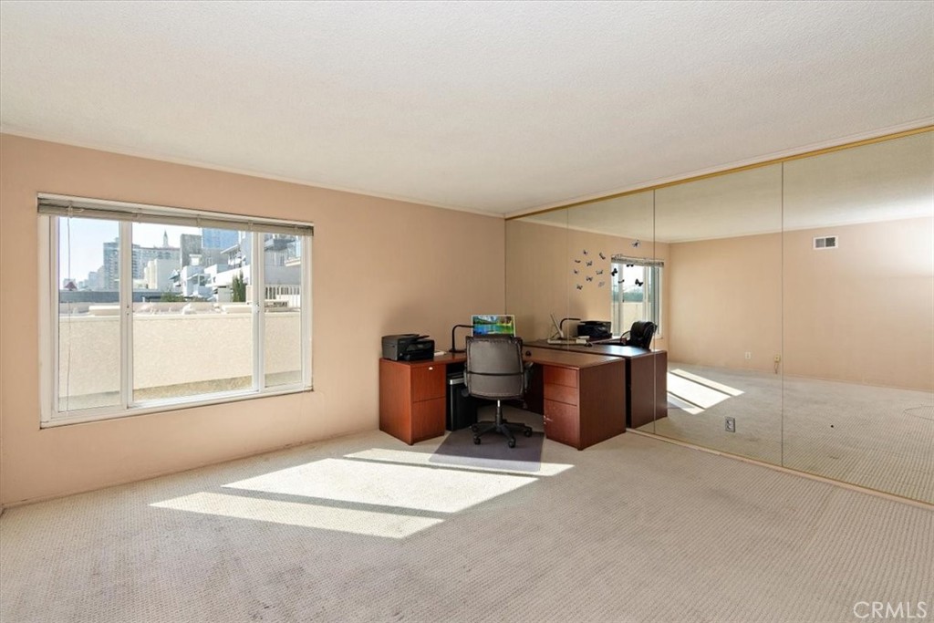 21 7th Place, Unit 409 Long Beach, CA 90802 - Photo 13 of 16 a living room with furniture a window and a table