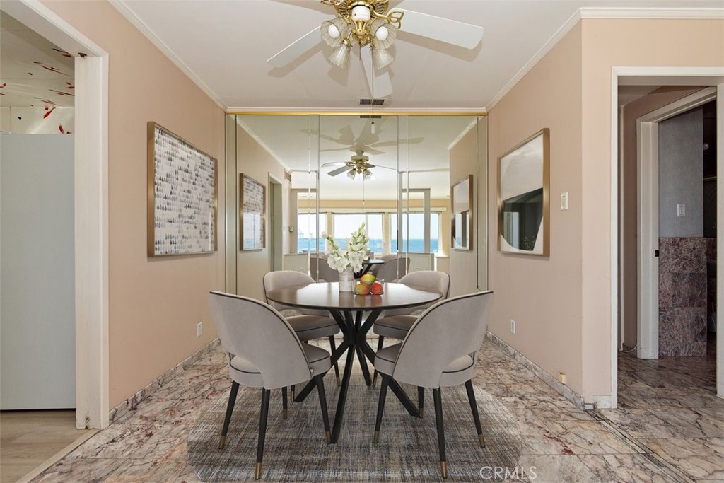 21 7th Place, Unit 409 Long Beach, CA 90802 - Photo 6 of 16 a view of a dining room with furniture window and wooden floor