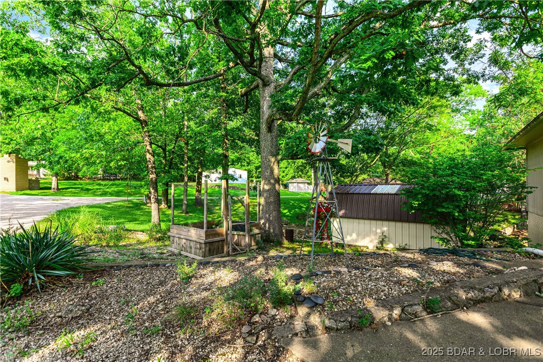 31945 Idle Wild Road Gravois Mills, MO 65037 - Photo 54 of 57 Garden spot and shed