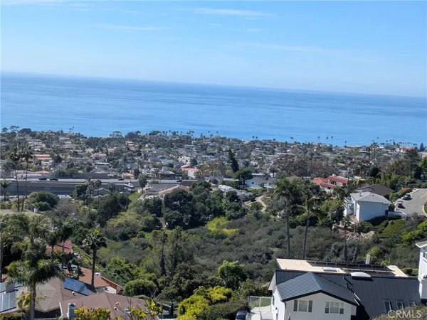 an aerial view of residential building and ocean