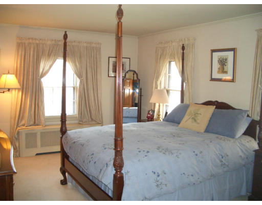 12 Burnside Road Newton, MA 02461 - Photo 11 of 18 a bedroom with a large bed and a chandelier