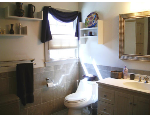 12 Burnside Road Newton, MA 02461 - Photo 15 of 18 a bathroom with a toilet sink and mirror