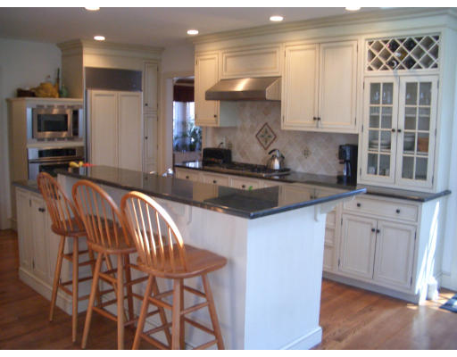 12 Burnside Road Newton, MA 02461 - Photo 9 of 18 a kitchen with granite countertop a stove a sink and a refrigerator