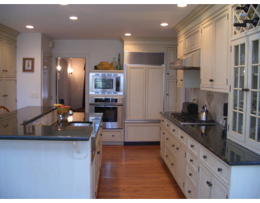 12 Burnside Road Newton, MA 02461 - Photo 10 of 18 a kitchen with kitchen island granite countertop a sink cabinets and stainless steel appliances