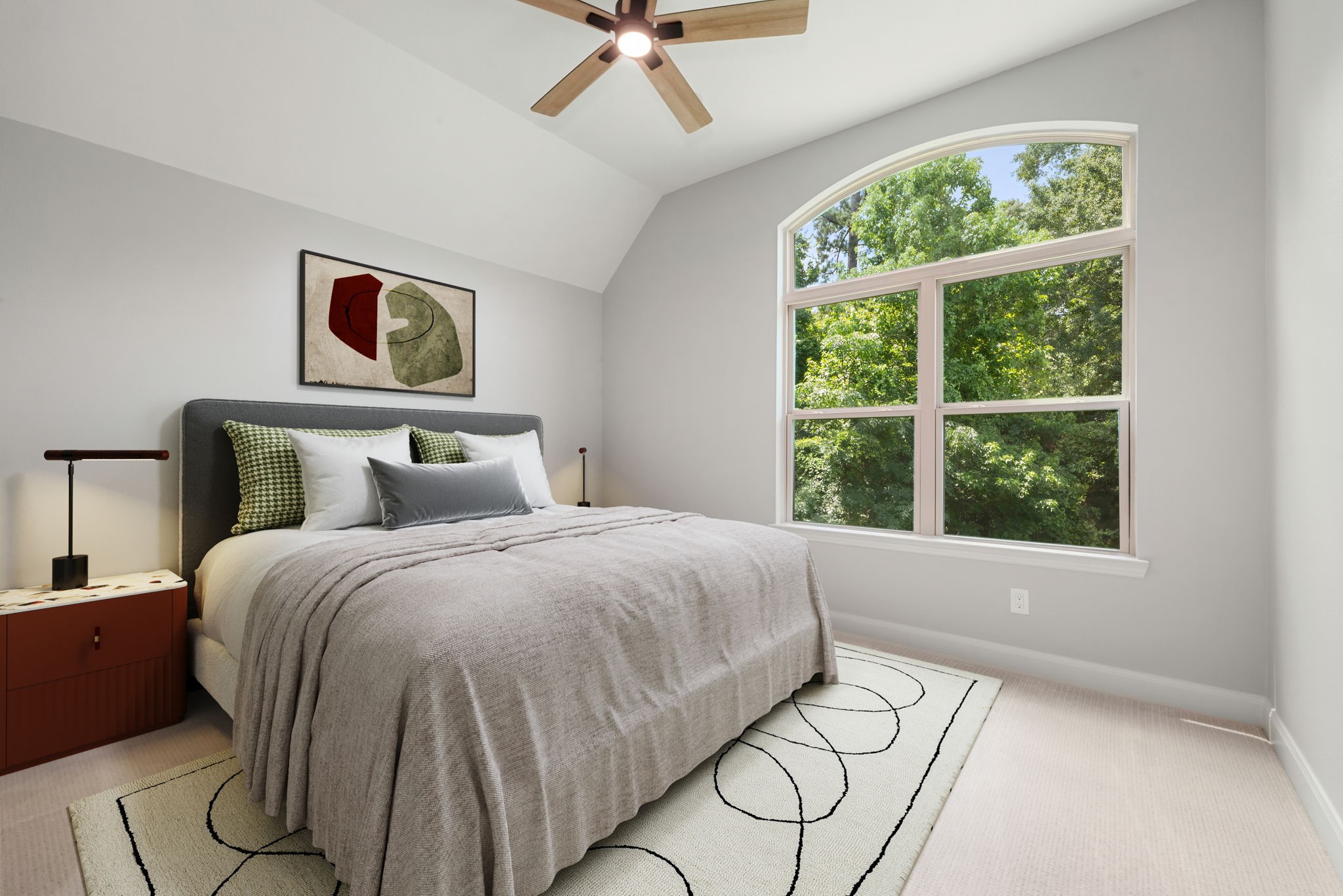 98 Herons Flight Place Spring, TX 77389 - Photo 19 of 29 Bright secondary bedroom with vaulted ceiling, arched window overlooking greenery, and neutral tones throughout. *Virtually Staged