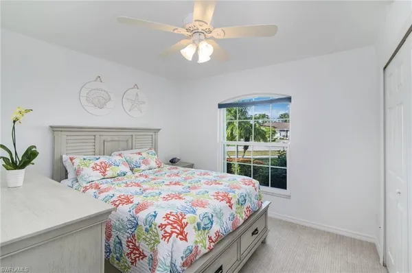 a bedroom with a bed and a table in it