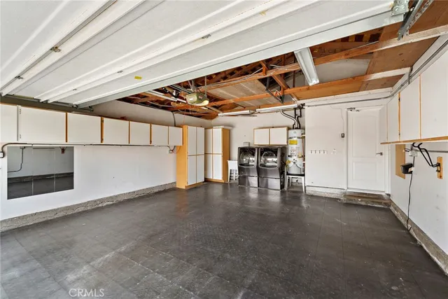 a view of a water heater room with a garage