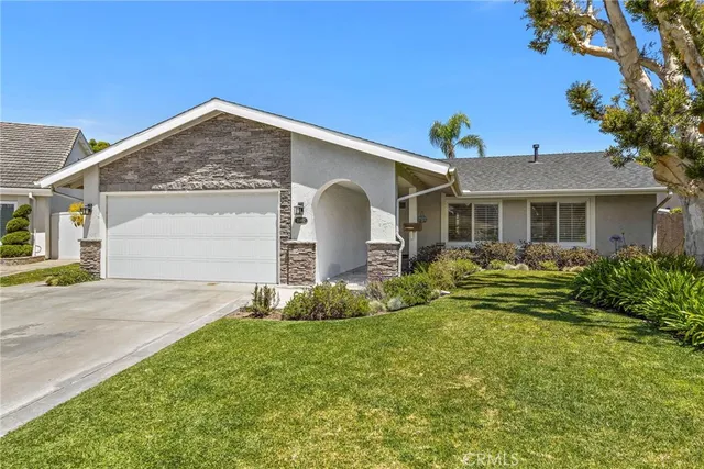 a front view of a house with a yard and porch
