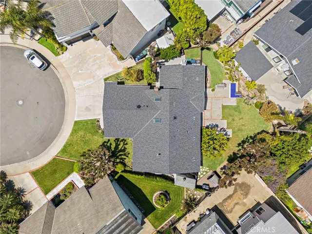 an aerial view of a house with a swimming pool