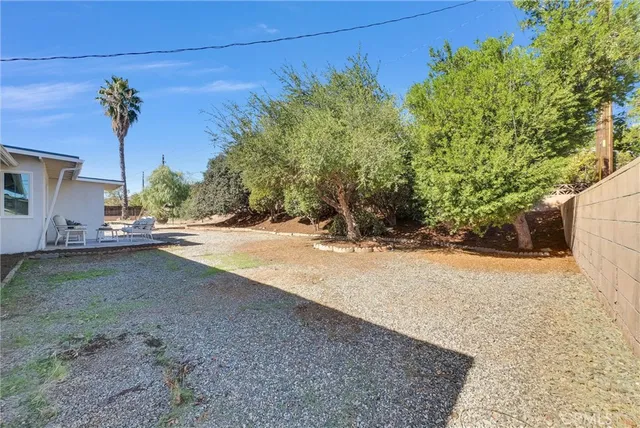 a view of a yard with a tree