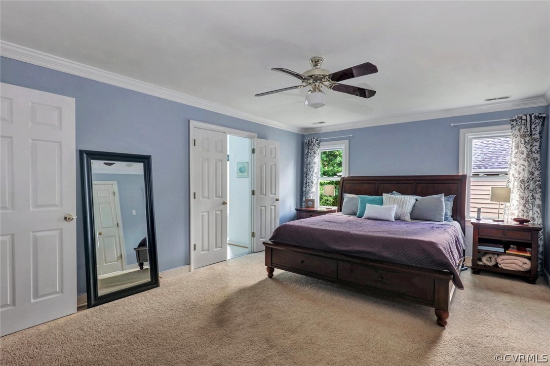 5309 Meadow Chase Road Midlothian, VA 23112 - Photo 23 of 32 a spacious bedroom with a bed and a chandelier