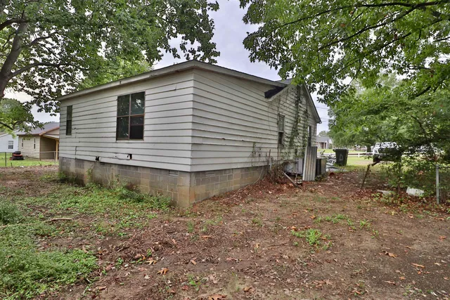 a view of a house with a tree