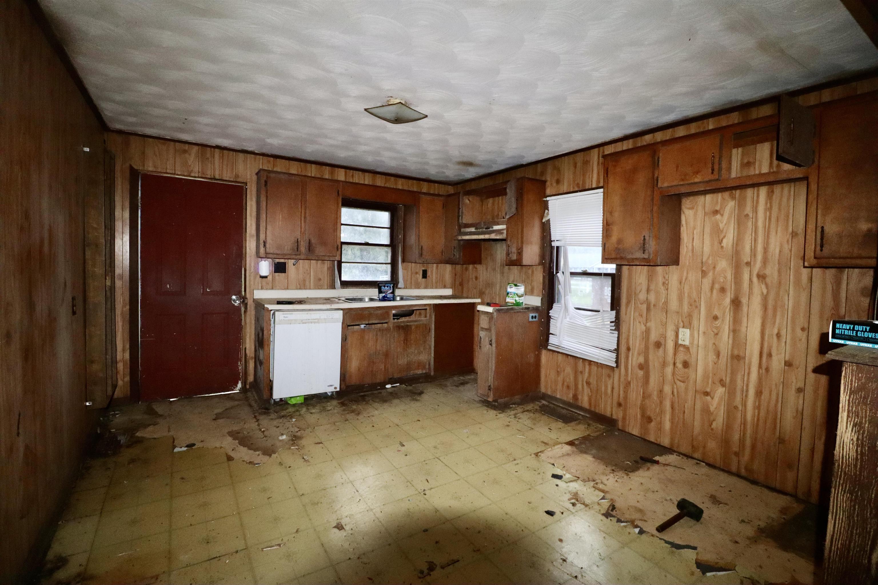 224 Kellar Avenue Ripley, TN 38063 - Photo 6 of 26 a kitchen with sink cabinets and window