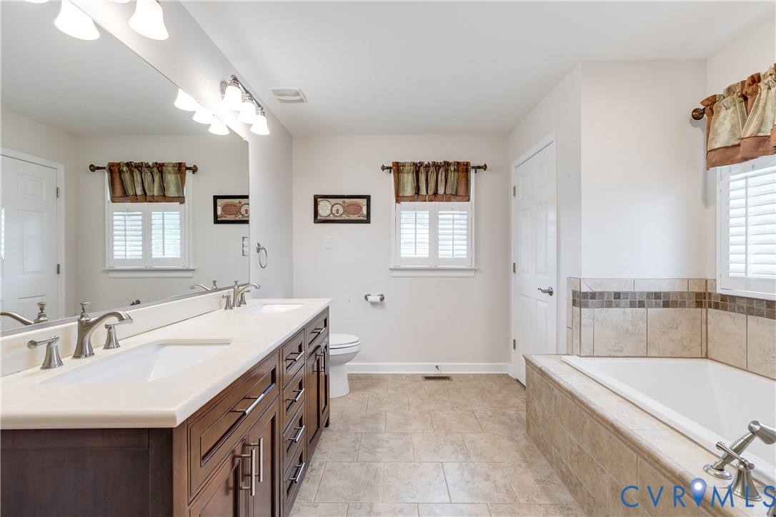 12365 Ashcake Road Ashland, VA 23005 - Photo 30 of 80 Primary Bathroom featuring a dual vanity with a li