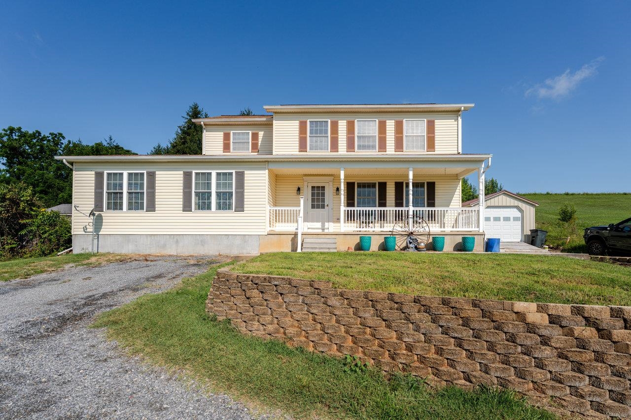 107 Orchard Road Staunton, VA 24401 - Photo 2 of 44 a front view of a house with a yard
